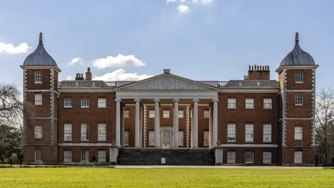 Osterley House's columned entrance and two towers, viewed across the lawn
